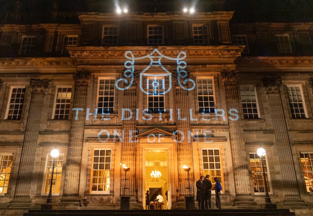 The Distillers One of One projected on the venue facade in Scotland