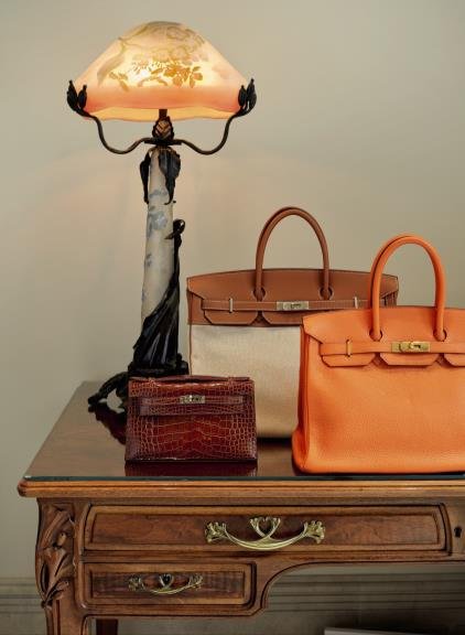 Hermès Kelly and Birkin handbags offered in the online sale, with estimates ranging from $500 to 28,000.