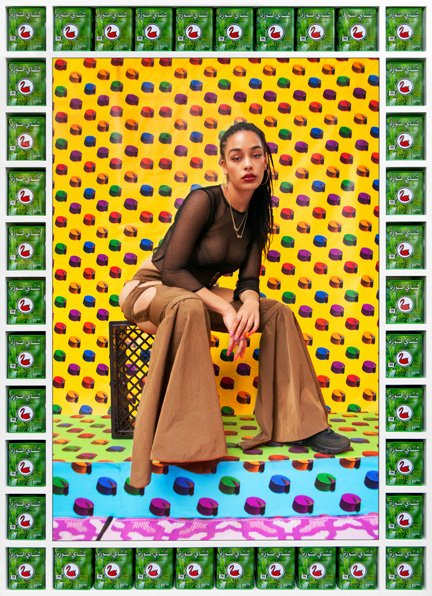 Hassan Hajjaj, portrait of a young Londoner from Ends to Estates, shot against a patterned backdrop with a bordered frame of packaging