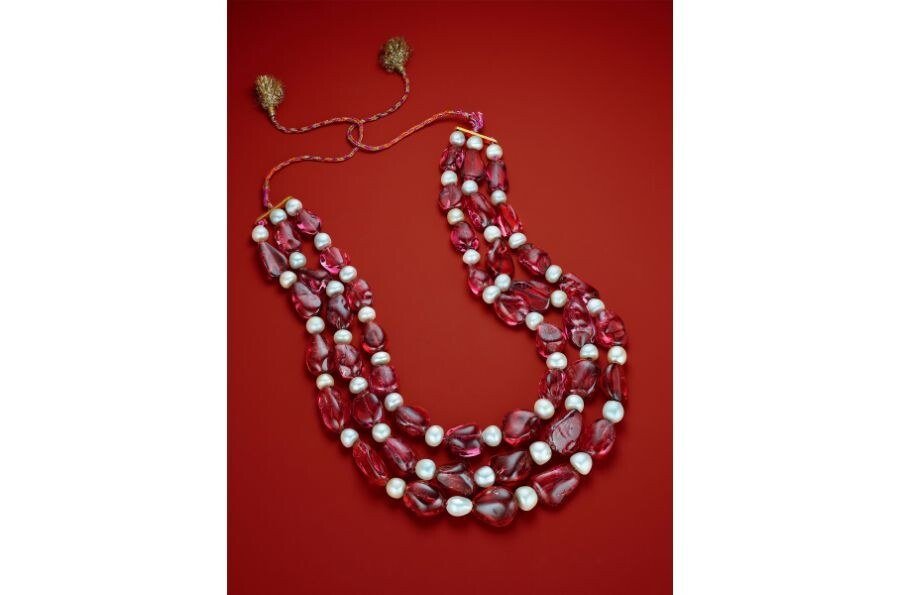 A Mughal three-strand spinel and natural pearl necklace, its eight inscribed stones weighing more than 2,000 carats in total