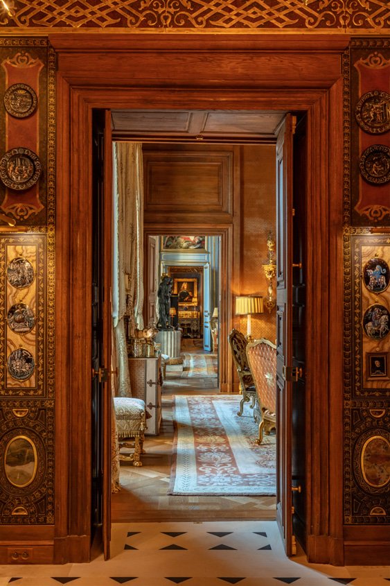 An enfilade of the H&ocirc;tel Lambert interiors that housed the collection.