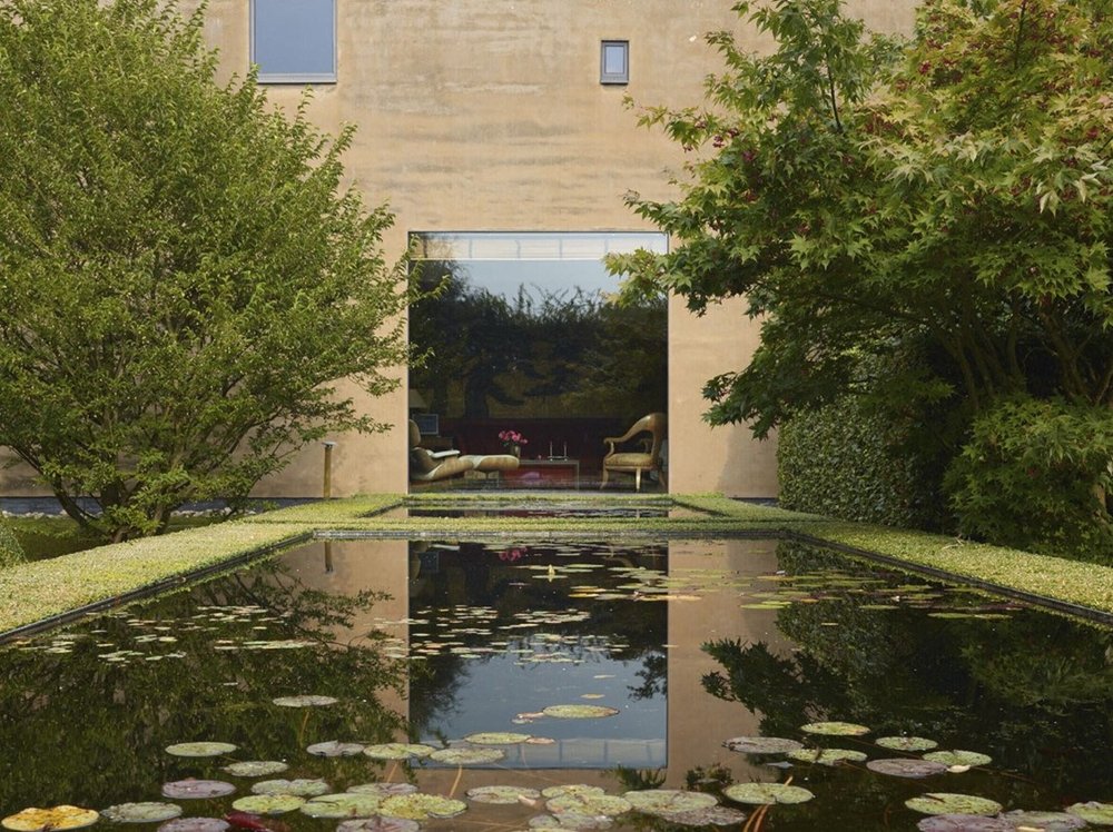 The Onzea-Govaerts home in Flanders, its reflecting pool framing a Vervoordt-curated interior