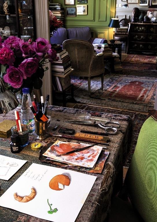 Pierre Le-Tan’s working desk in his Paris apartment, where the collection was assembled over more than 40 years.