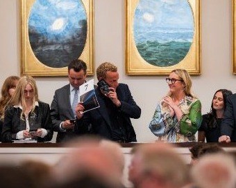 Sotheby&rsquo;s specialists relay telephone bids during the sale.